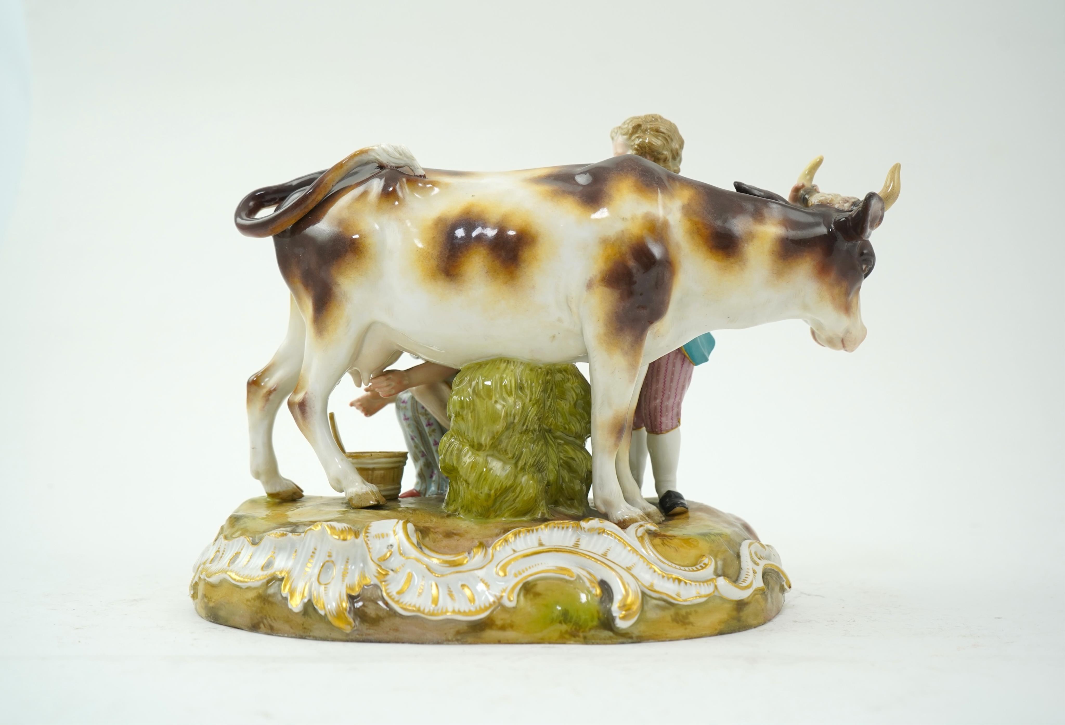 A Meissen group of a boy and girl milking a cow, 19th century
